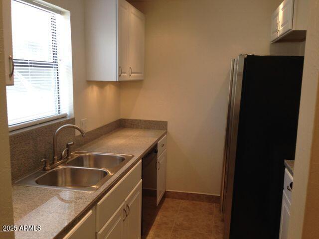 3119 North 38th Street, Unit 10 Phoenix, AZ 85018 - Photo 4 of 20 a kitchen with a sink a refrigerator and window
