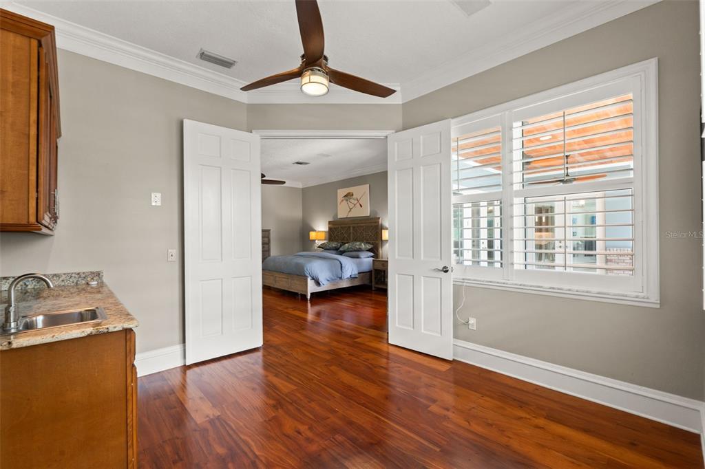 6936 River Road New Port Richey, FL 34652 - Photo 31 of 93 a view of room with workspace and wooden floor
