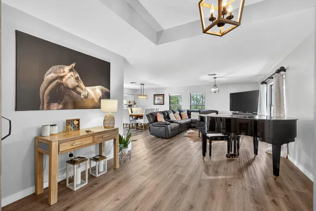 a swimming pool with outdoor seating and yard