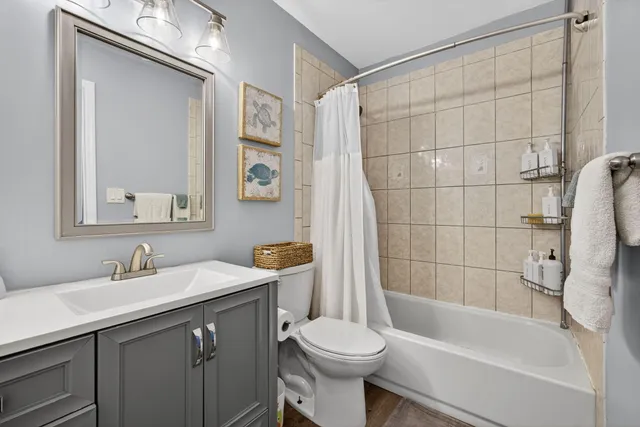 an aerial view of residential houses with outdoor space and swimming pool