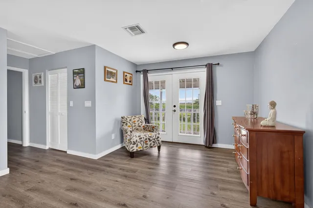 a view of a swimming pool with a patio and a yard