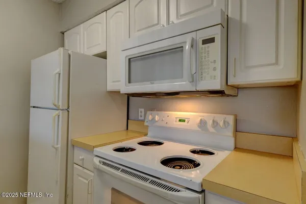 a bathroom with a sink and cabinets