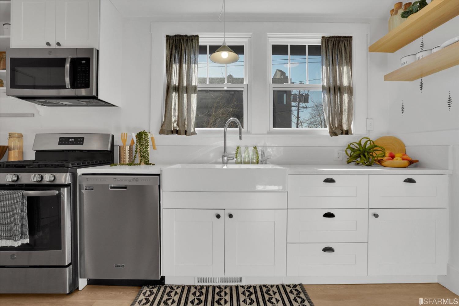 1921 Seventh Street Berkeley, CA 94710 - Photo 12 of 37 a kitchen with a sink and cabinets