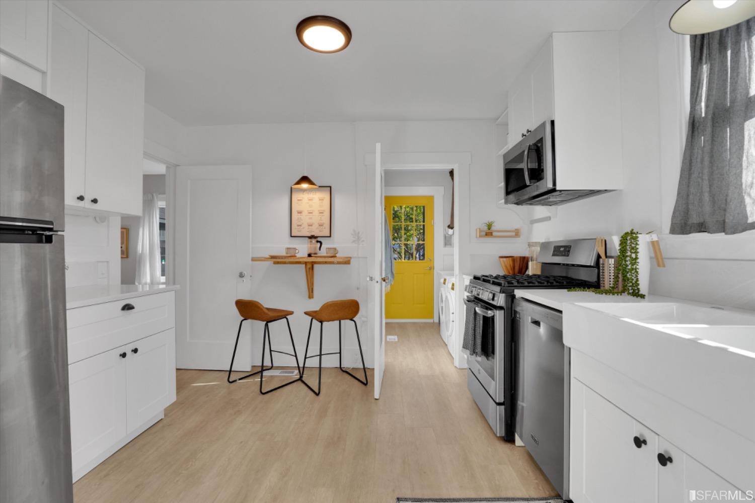 1921 Seventh Street Berkeley, CA 94710 - Photo 16 of 37 a kitchen with stainless steel appliances granite countertop a sink and cabinets