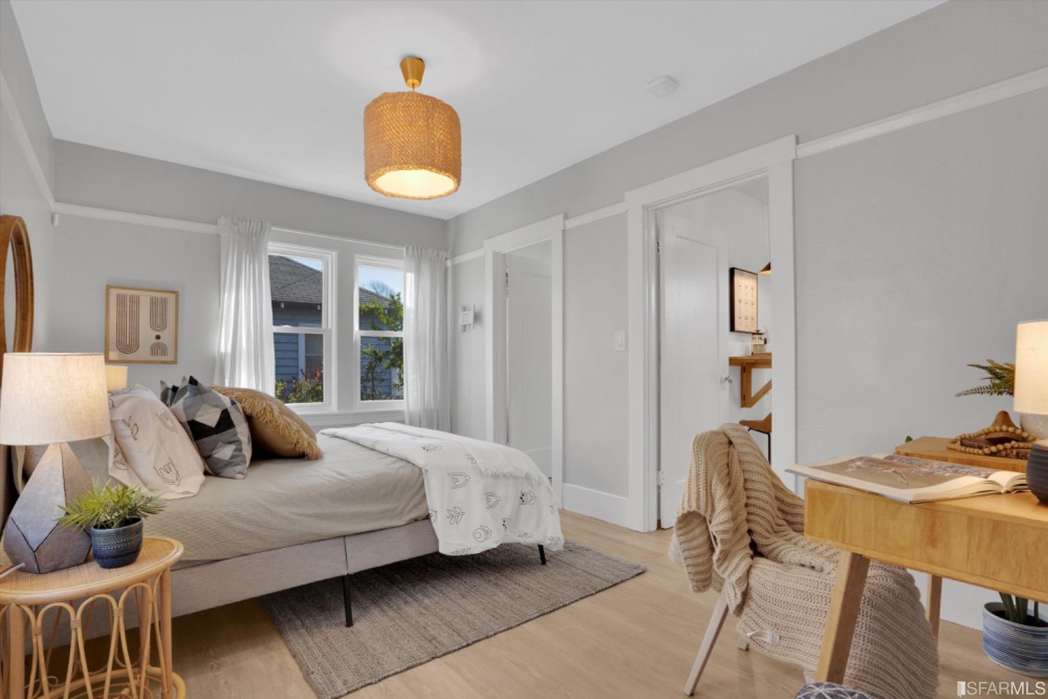 1921 Seventh Street Berkeley, CA 94710 - Photo 17 of 37 a bedroom with a bed and wooden floor