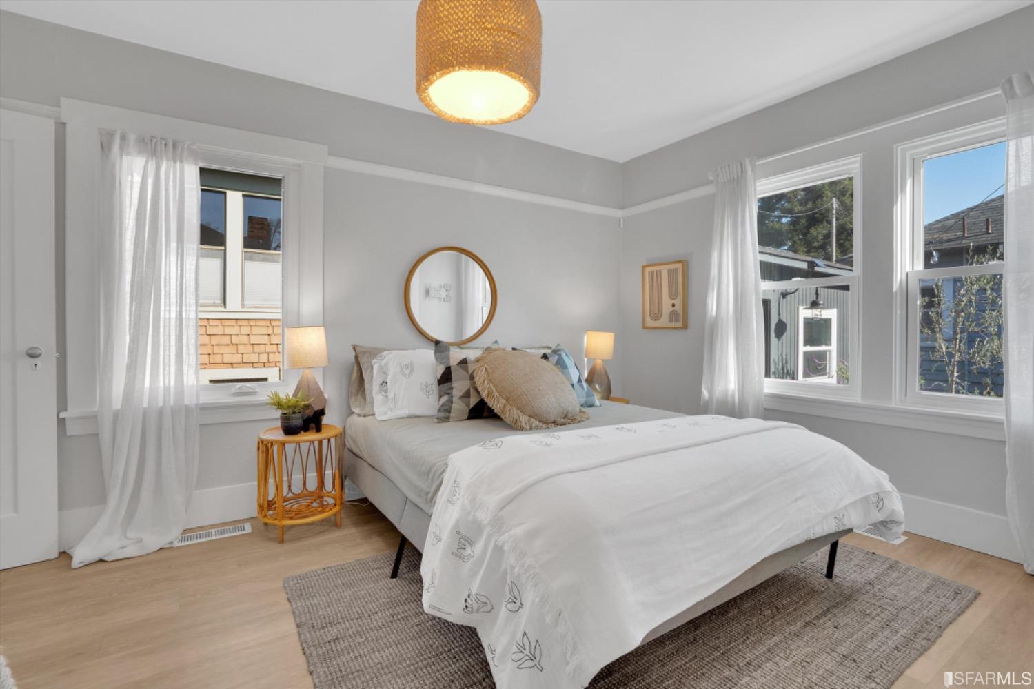 1921 Seventh Street Berkeley, CA 94710 - Photo 18 of 37 a bedroom with a bed and window