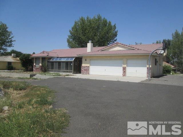 3148 Bottom Road Fallon, NV 89406 - Photo 1 of 25 a front view of a house with a garden