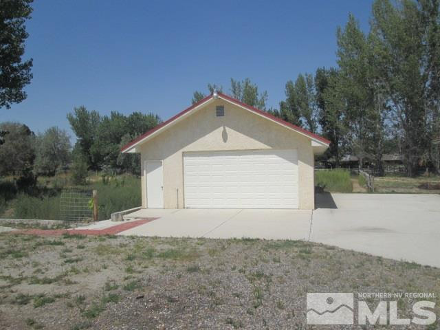 3148 Bottom Road Fallon, NV 89406 - Photo 20 of 25 a backyard of a house with lots of green space and lake view