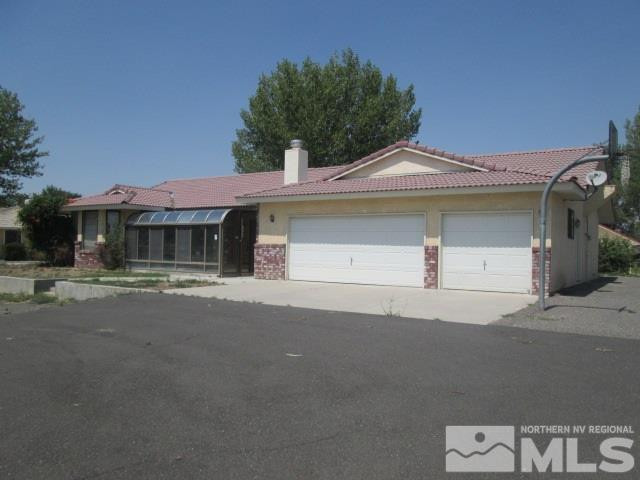 3148 Bottom Road Fallon, NV 89406 - Photo 3 of 25 a front view of a house with a yard