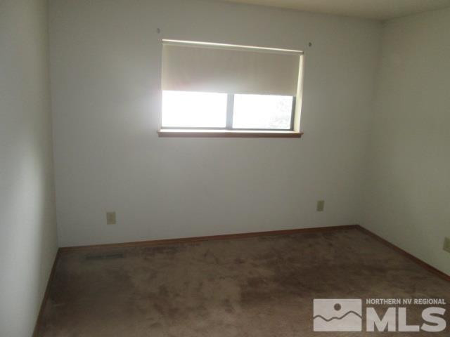 3148 Bottom Road Fallon, NV 89406 - Photo 6 of 25 an empty room with a window