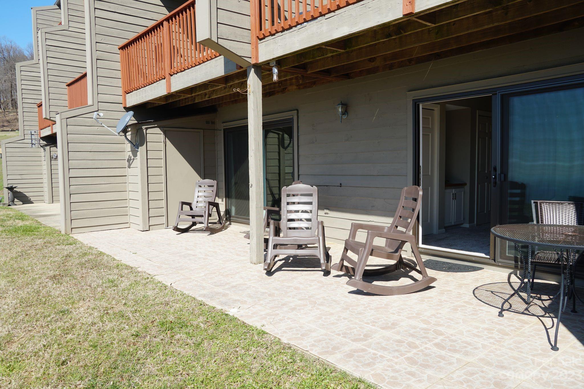 2881 White Oak Mountain Road, Unit D2 Columbus, NC 28722 - Photo 12 of 39 a view of a lounge chair in the balcony