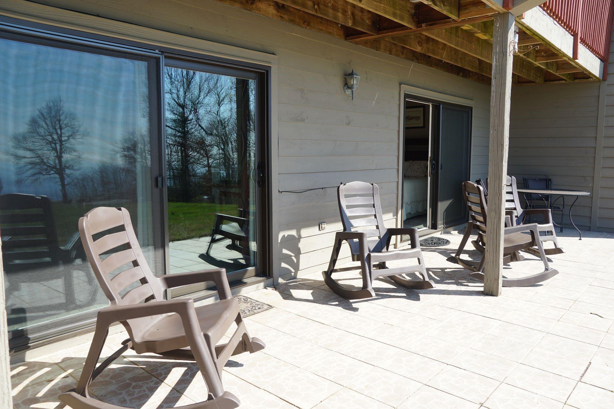2881 White Oak Mountain Road, Unit D2 Columbus, NC 28722 - Photo 15 of 39 a view of the patio with a dining table and chairs