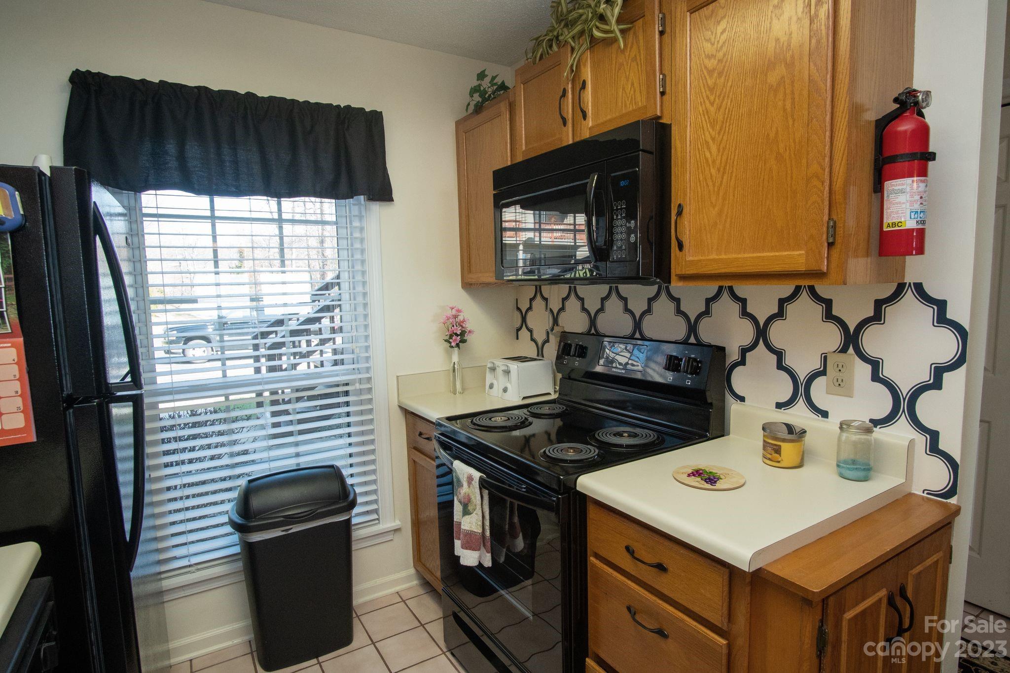 2881 White Oak Mountain Road, Unit D2 Columbus, NC 28722 - Photo 19 of 39 a kitchen that has a stove and a microwave