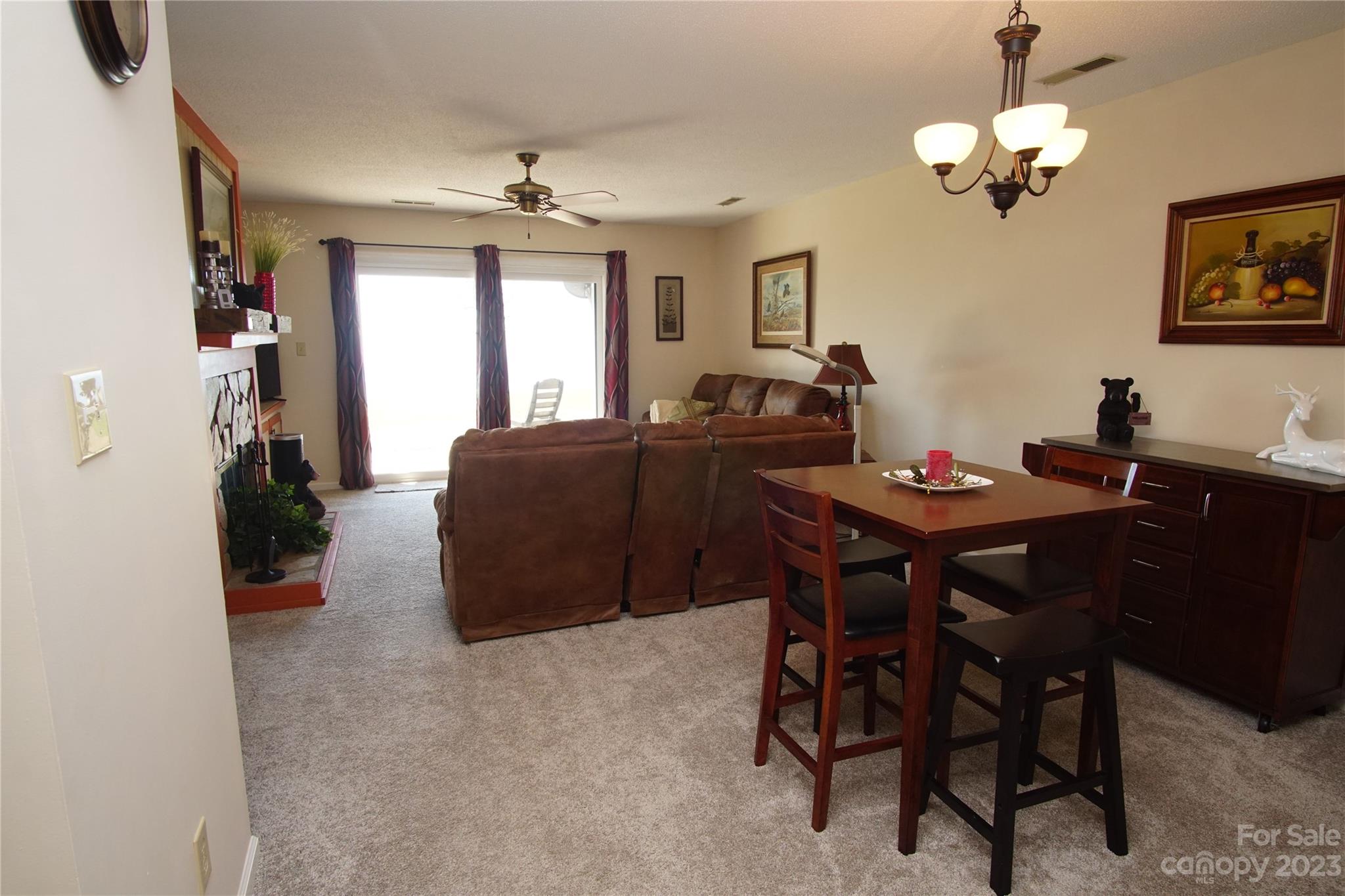 2881 White Oak Mountain Road, Unit D2 Columbus, NC 28722 - Photo 23 of 39 a view of a dining room with furniture and chandelier