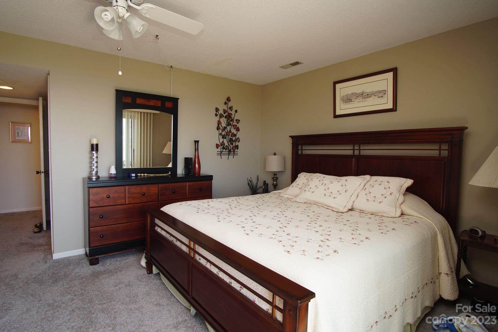 2881 White Oak Mountain Road, Unit D2 Columbus, NC 28722 - Photo 25 of 39 a bedroom with a bed and a dresser