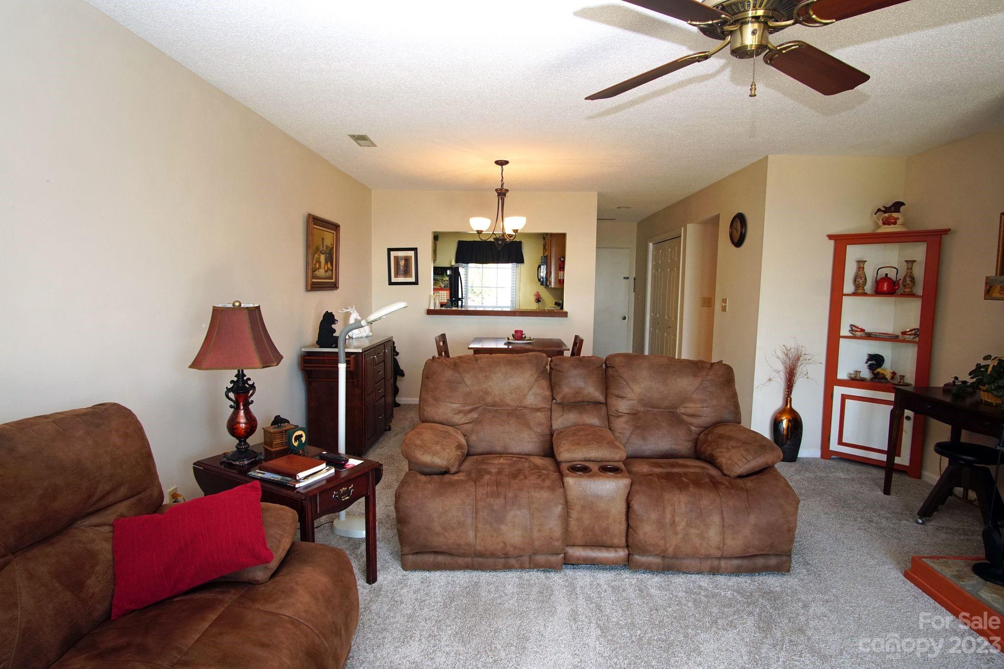 2881 White Oak Mountain Road, Unit D2 Columbus, NC 28722 - Photo 27 of 39 a living room with furniture and a wooden floor