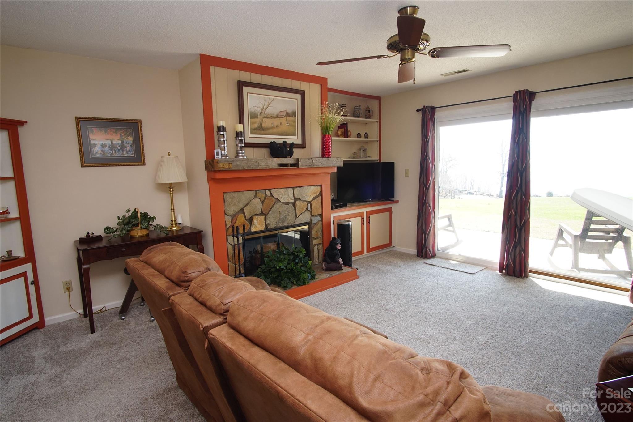 2881 White Oak Mountain Road, Unit D2 Columbus, NC 28722 - Photo 28 of 39 a living room with furniture and a flat screen tv