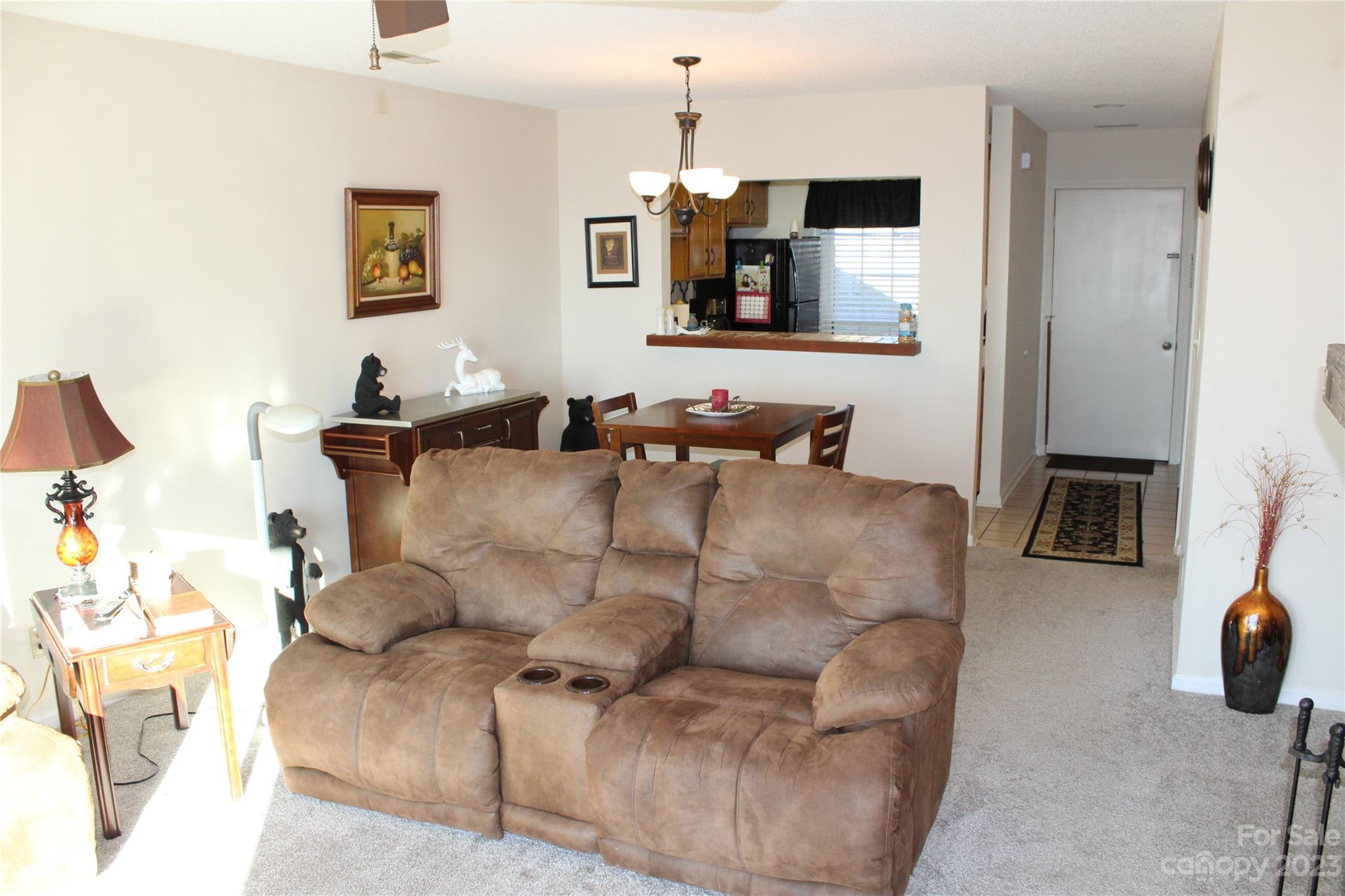 2881 White Oak Mountain Road, Unit D2 Columbus, NC 28722 - Photo 29 of 39 a living room with furniture and a flat screen tv