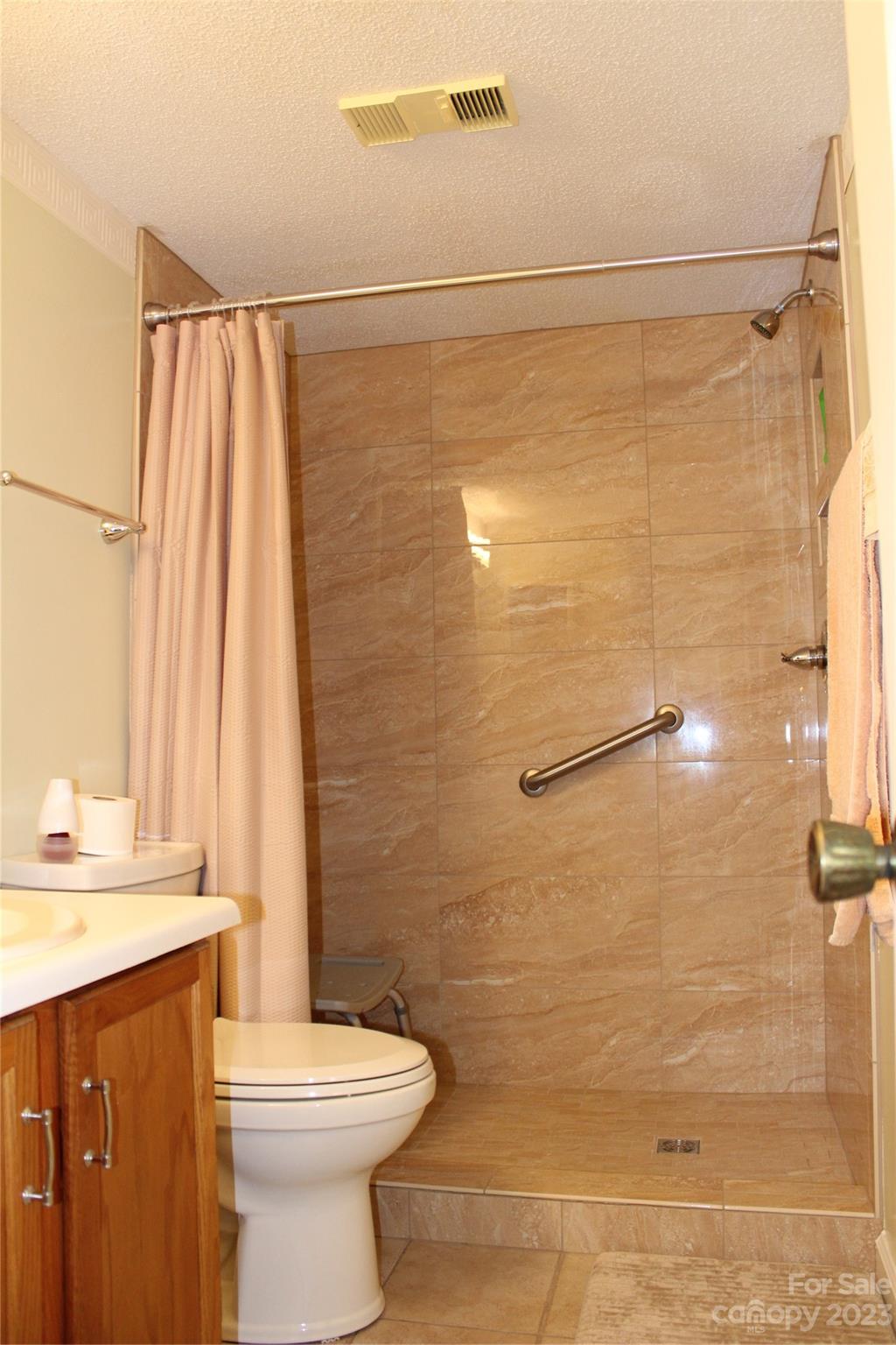 2881 White Oak Mountain Road, Unit D2 Columbus, NC 28722 - Photo 33 of 39 a bathroom with a sink a toilet and shower