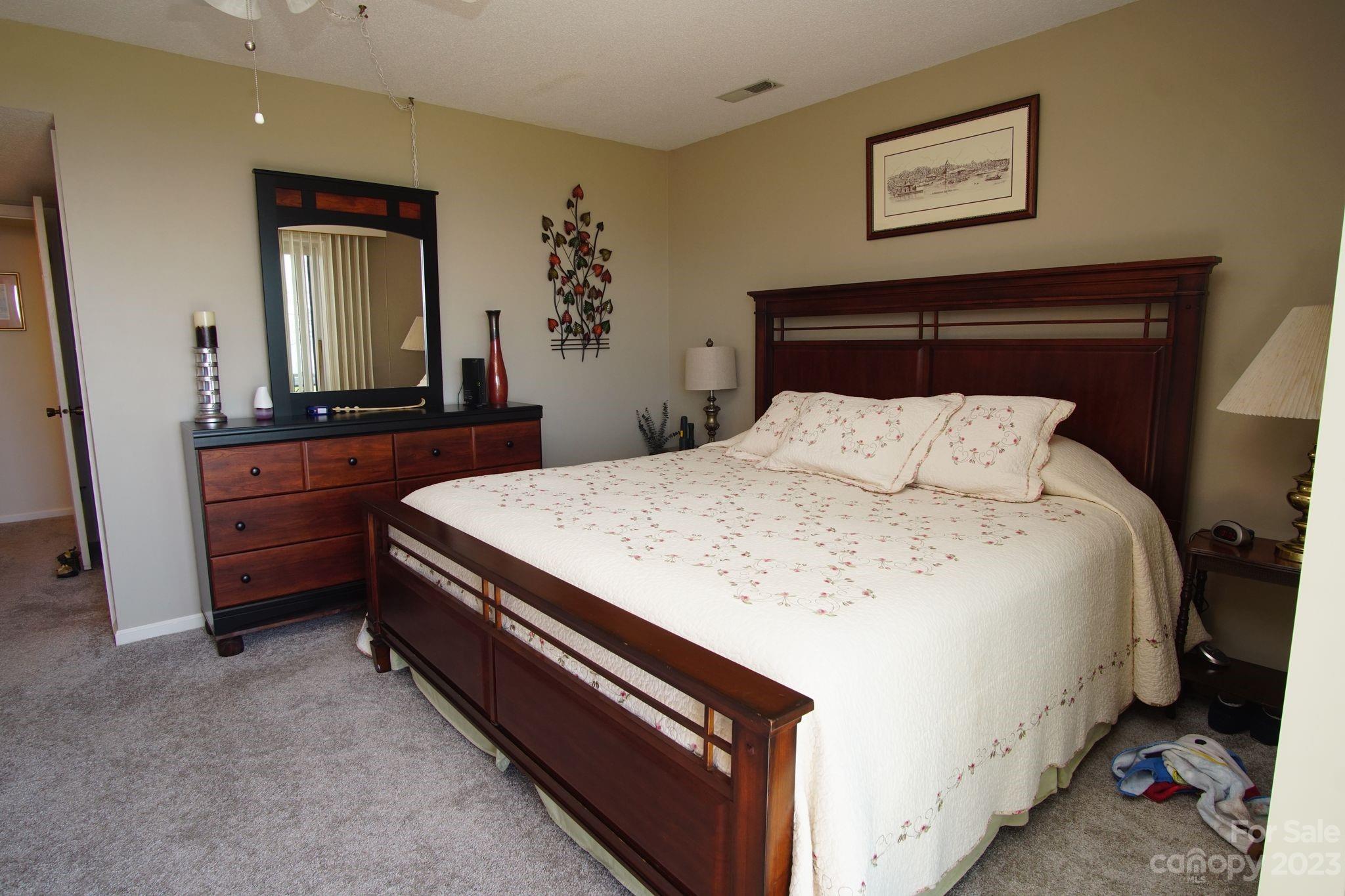 2881 White Oak Mountain Road, Unit D2 Columbus, NC 28722 - Photo 38 of 39 a bedroom with a bed and a dresser