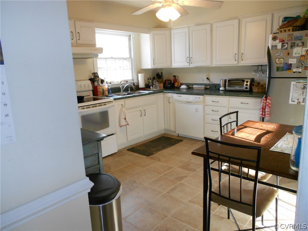 11019 Rockledge Road Richmond, VA 23235 - Photo 12 of 36 a kitchen with a sink cabinets and window