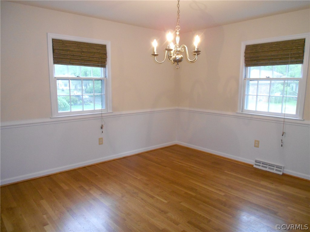 11019 Rockledge Road Richmond, VA 23235 - Photo 13 of 36 a view of empty room with wooden floor and fan