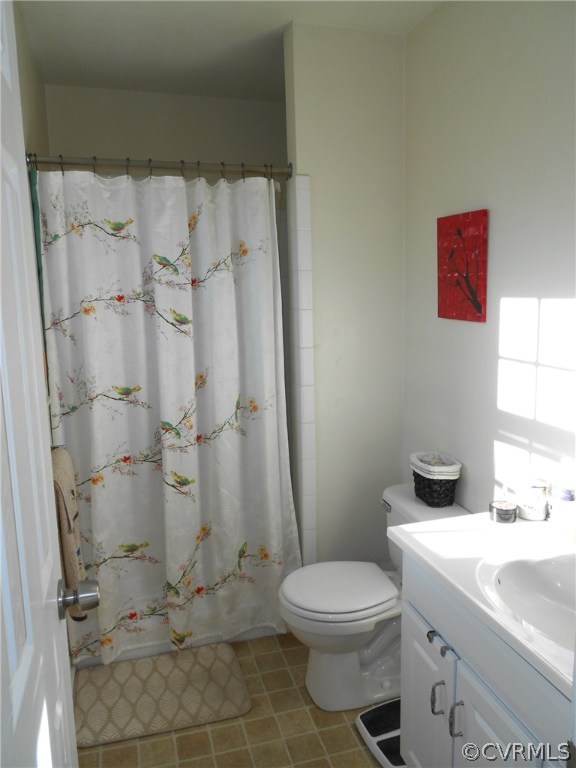 11019 Rockledge Road Richmond, VA 23235 - Photo 27 of 36 a bathroom with a granite countertop toilet and a sink