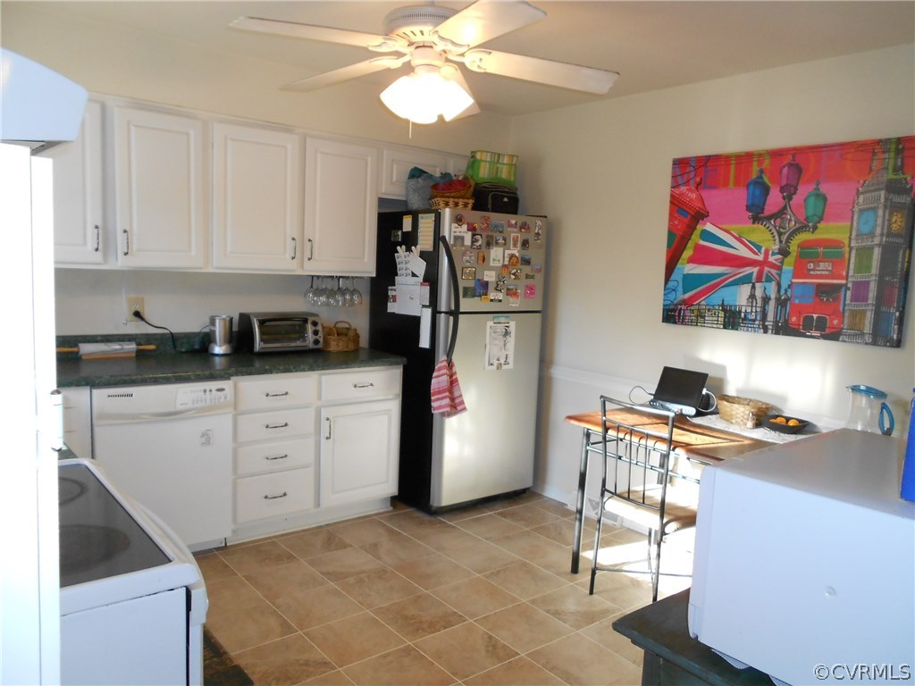 11019 Rockledge Road Richmond, VA 23235 - Photo 10 of 36 a kitchen with stainless steel appliances cabinets and a window