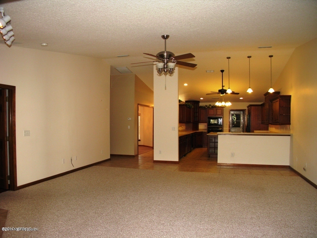 3128 Ravines Road Middleburg, FL 32068 - Photo 7 of 15 Family Rm toward Kitchen
