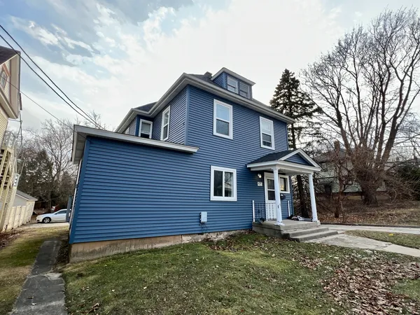 a front view of a house with a yard