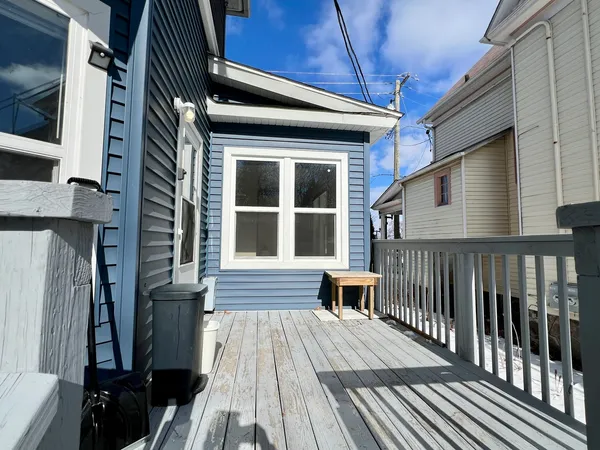 a balcony view with a seating space