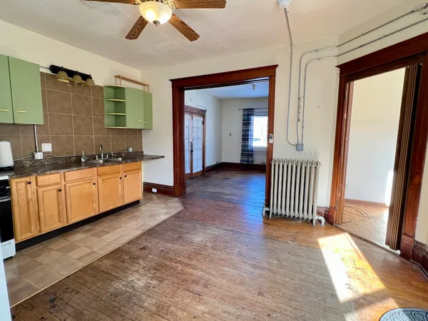 a view of a bathroom with a sink and a mirror