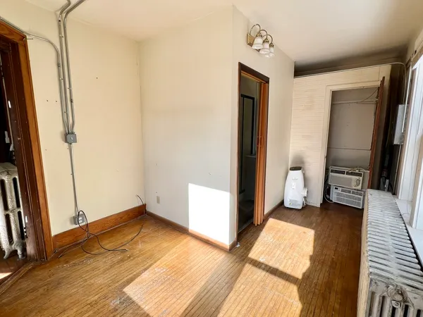 a view of a room with a hallway