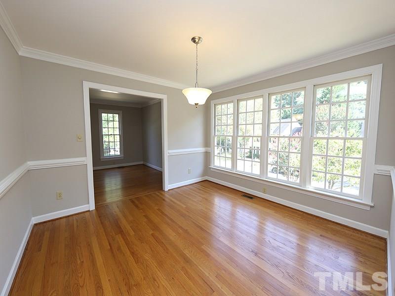 7621 Pinewild Court Raleigh, NC 27615 - Photo 3 of 14 a view of a room window and wooden floor
