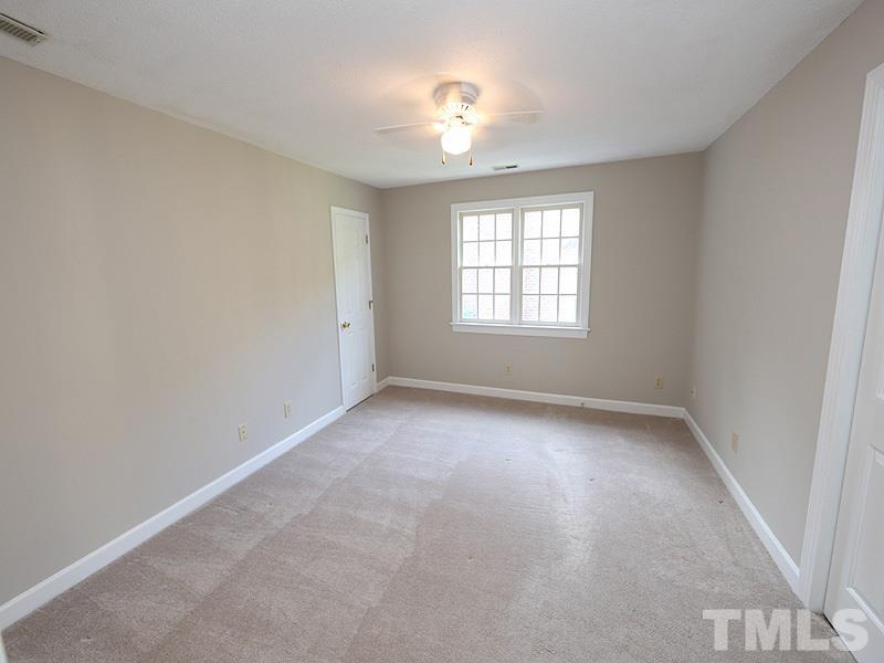 7621 Pinewild Court Raleigh, NC 27615 - Photo 10 of 14 an empty room with a window