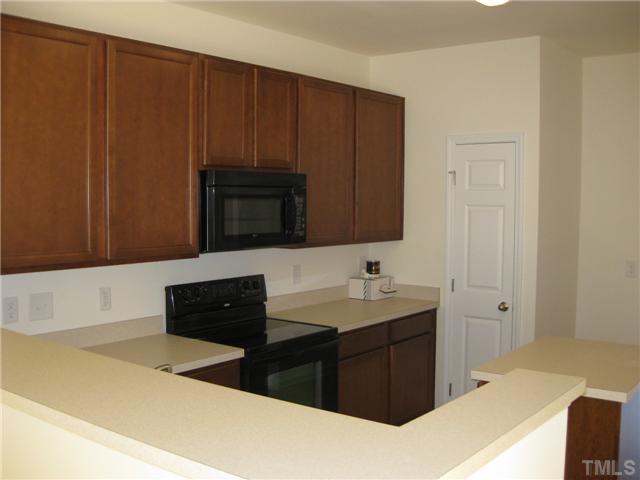 1648 Holly Grove Way Durham, NC 27713 - Photo 4 of 7 Another view of the kitchen, from the living room. Pull some stools up to the bar for a bite to eat!