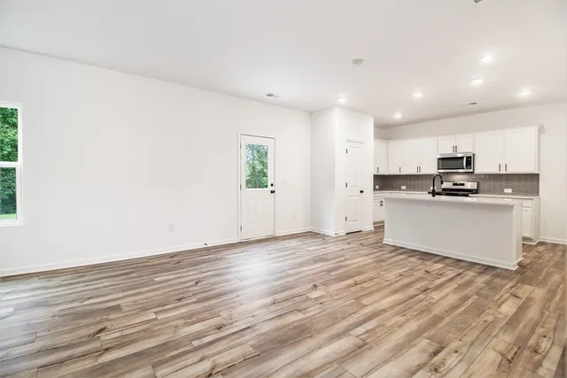 a view of kitchen with wooden floor