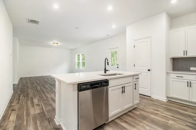 a kitchen with a sink and cabinets