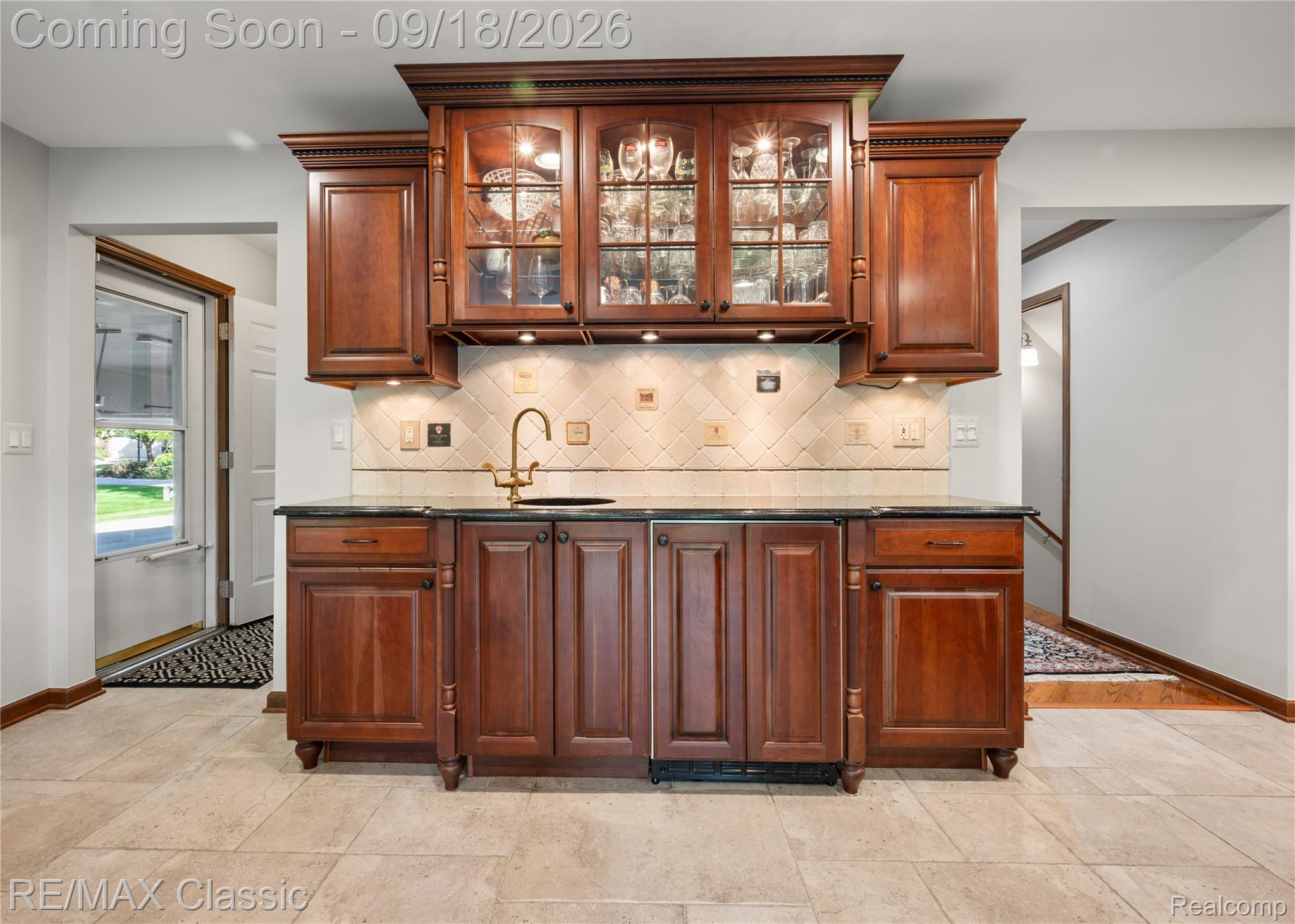 2899 Current Drive Rochester, MI 48309 - Photo 12 of 57 Wet bar and beverage refrigerator and beautiful cabinetry in kitchen nook.