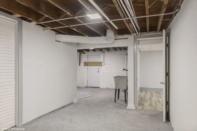 a view of an empty room with cabinet