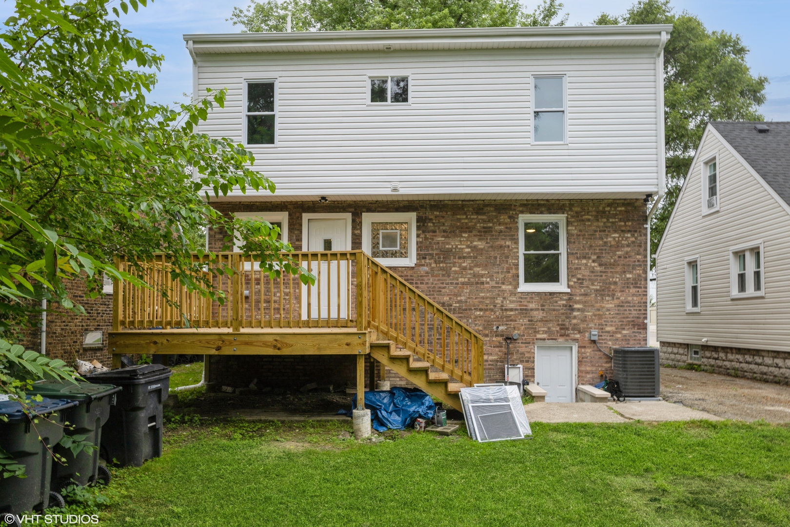 14727 East Riverside Drive South Holland, IL 60473 - Photo 2 of 12 a front view of a house with a garden and outdoor seating