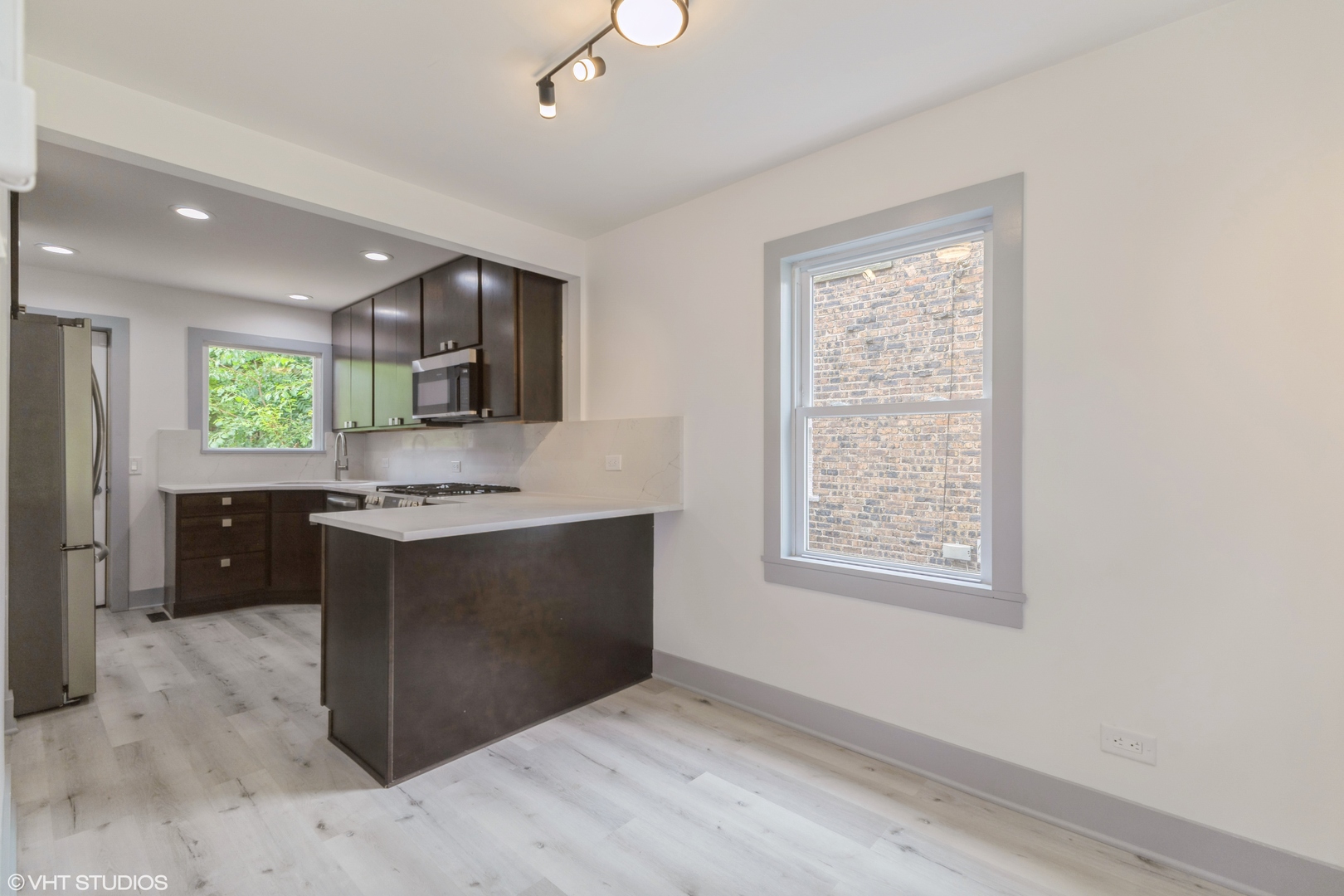 14727 East Riverside Drive South Holland, IL 60473 - Photo 9 of 12 a view of kitchen with granite countertop cabinets and window