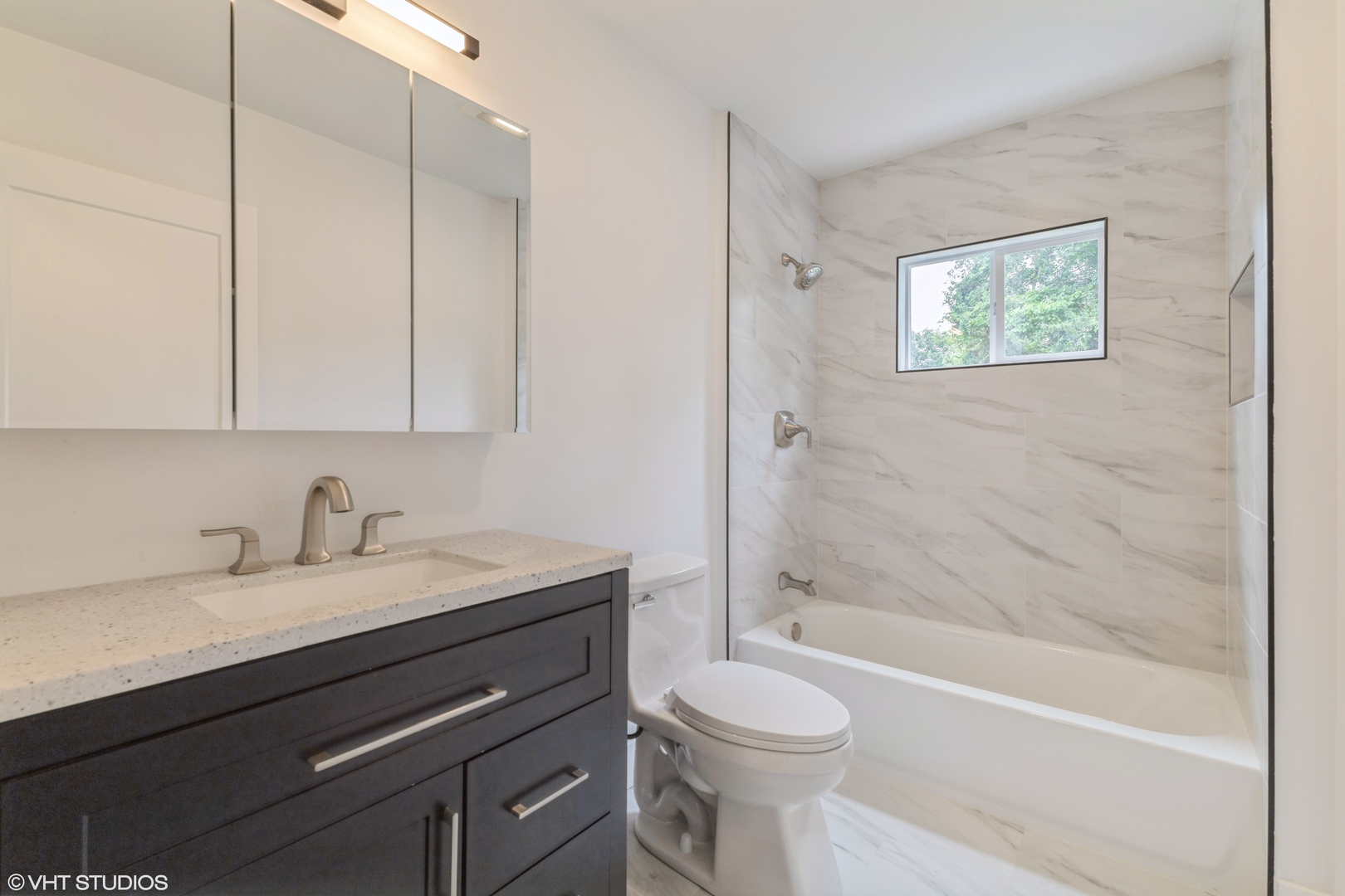 14727 East Riverside Drive South Holland, IL 60473 - Photo 10 of 12 a bathroom with a granite countertop sink a toilet and bathtub