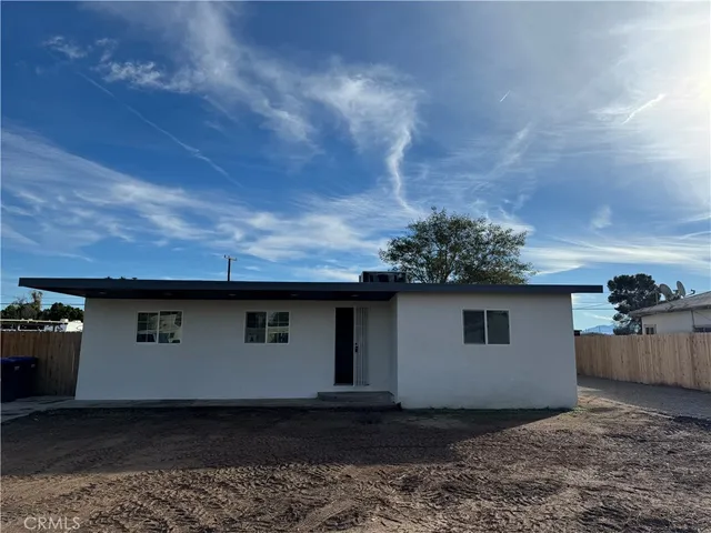 a front view of a house with yard