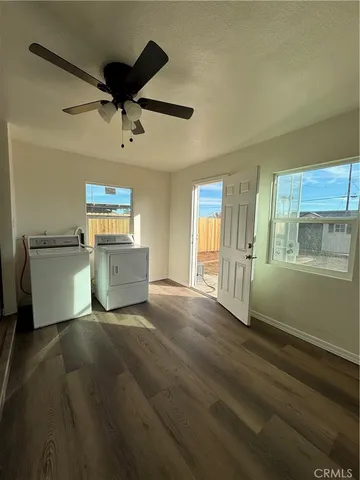 a view of a kitchen with microwave and cabinets