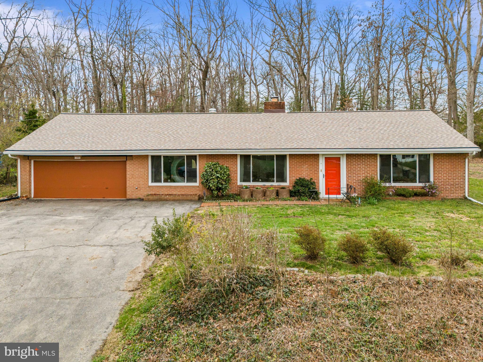 1303 Jefferson Road Fort Washington, MD 20744 - Photo 1 of 29 a front view of a house with garden