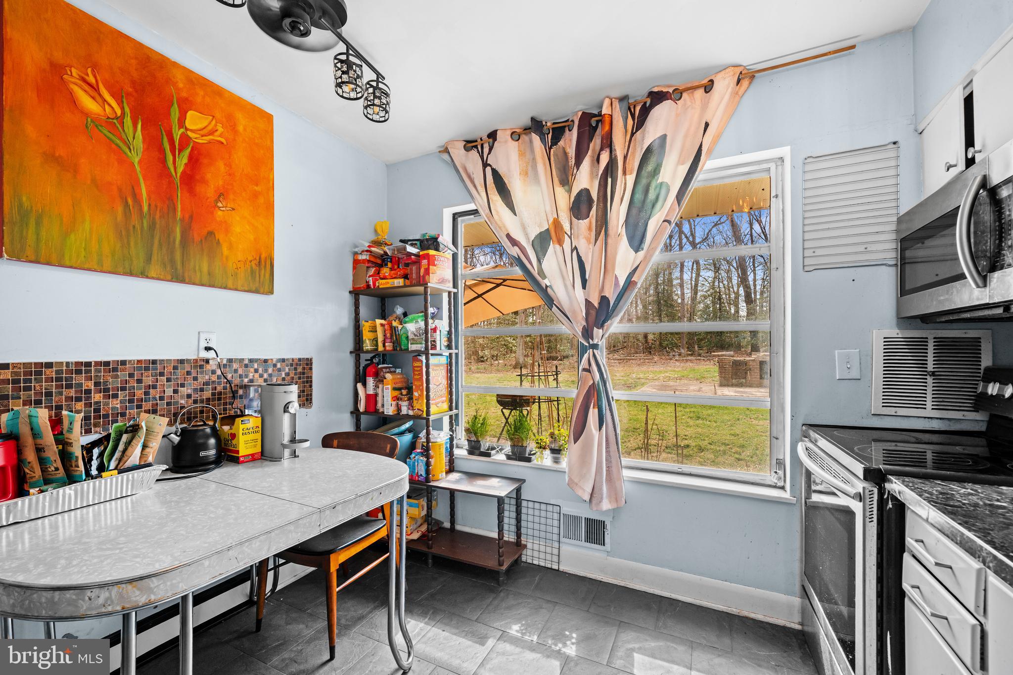 1303 Jefferson Road Fort Washington, MD 20744 - Photo 11 of 29 a dining room with furniture and a window
