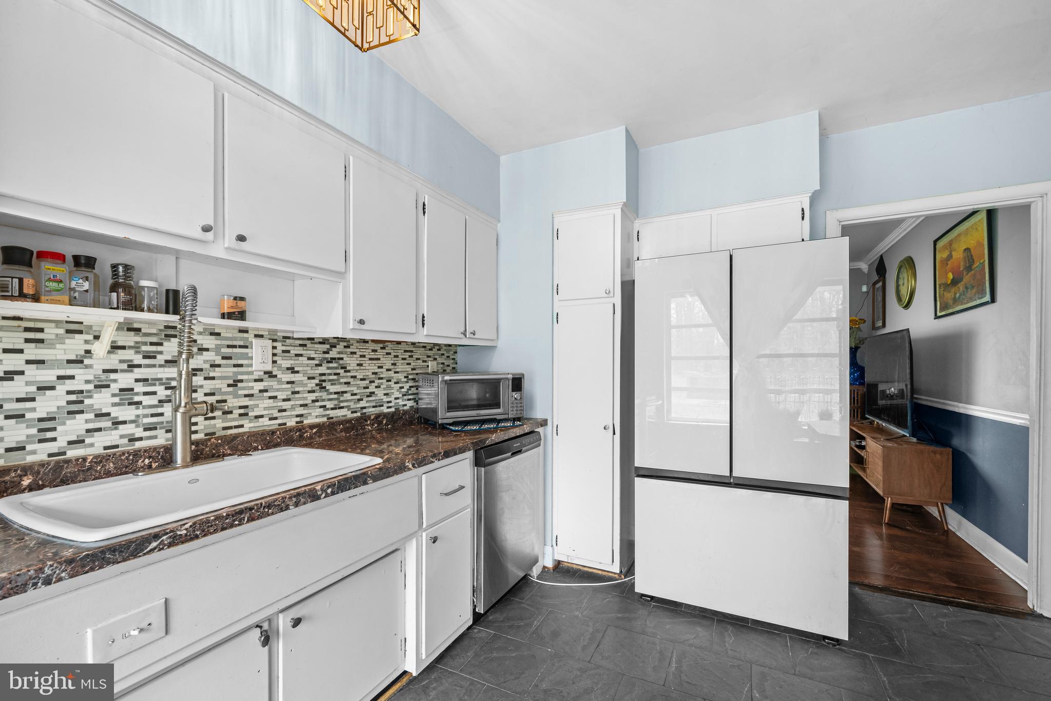 1303 Jefferson Road Fort Washington, MD 20744 - Photo 12 of 29 a kitchen with granite countertop white cabinets and white appliances