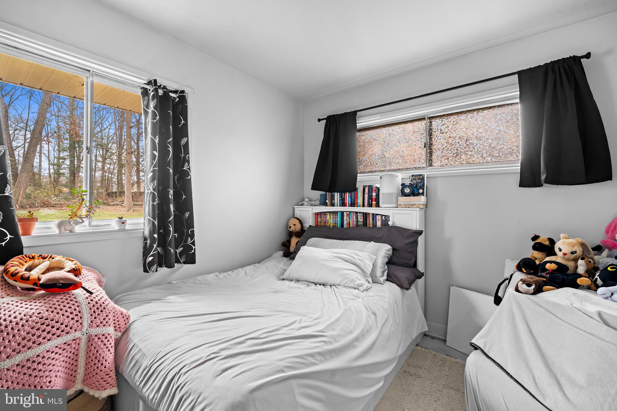 1303 Jefferson Road Fort Washington, MD 20744 - Photo 15 of 29 a bedroom with a bed and a large window