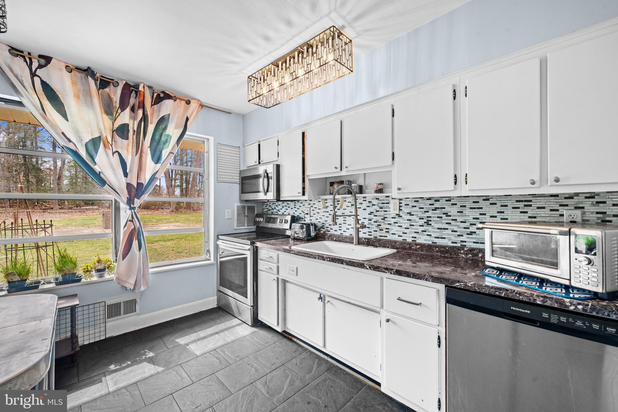 1303 Jefferson Road Fort Washington, MD 20744 - Photo 10 of 29 a kitchen with stainless steel appliances granite countertop a sink and a stove